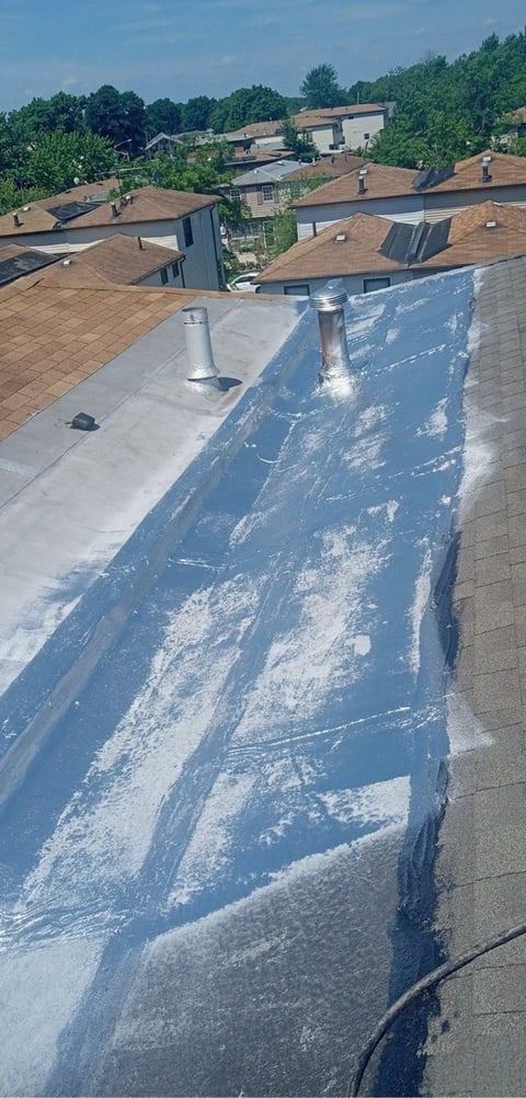 Aerial view: roof repair with protective tarp