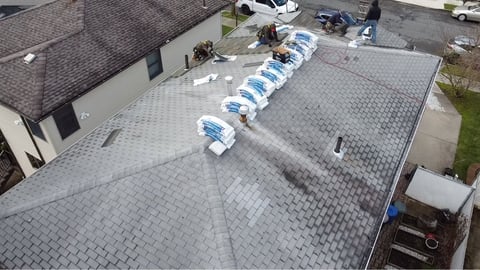Aerial view: shingle installation in progress