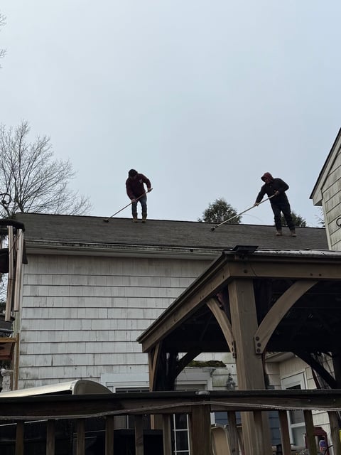 Roof cleaning in progress